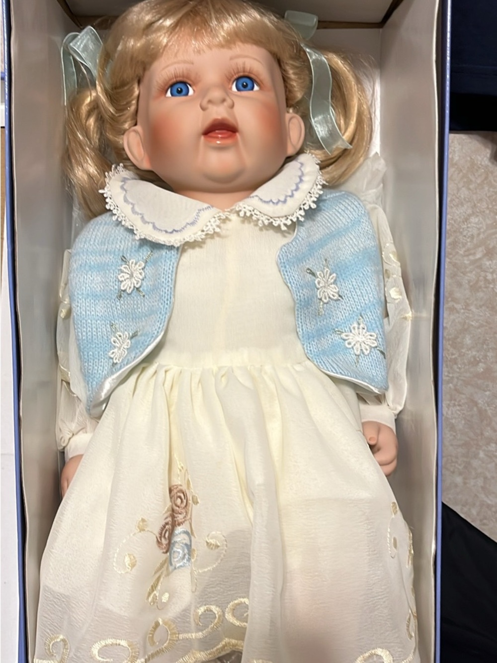 NY Collection Blonde Doll in Cream Dress with Light Blue Vest